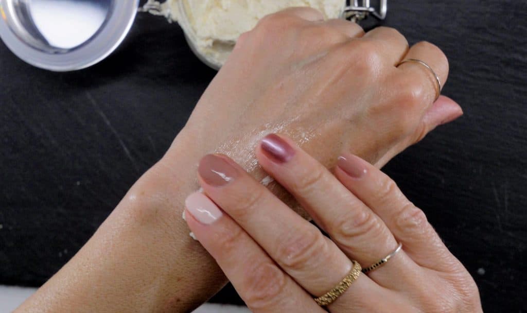 applying cocoa body butter